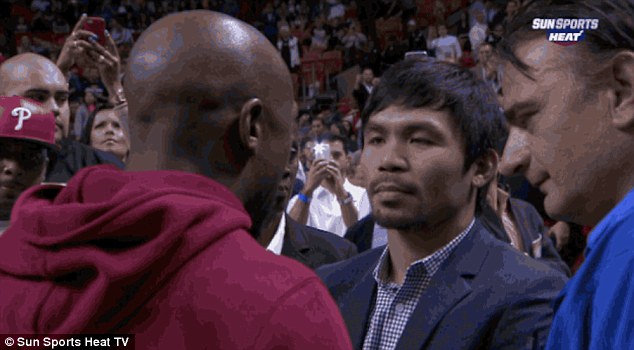 25216EB600000578-2929269-Mayweather_and_Pacquiao_speak_during_half_time_of_the_Miami_Heat-a-2_1422421089675 - MyMMANews Manny Pacquiao has words for Ronda Rousey