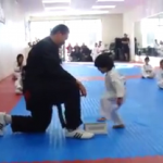 Watch little kid earn belt after learning to break board in Taekwondo