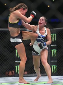 Jul 25, 2015; Chicago, IL, USA; Jessica Eye (blue gloves) fights against Miesha Tate (red gloves) during UFC Fight Night at United Center. Mandatory Credit: Dennis Wierzbicki-USA TODAY Sports