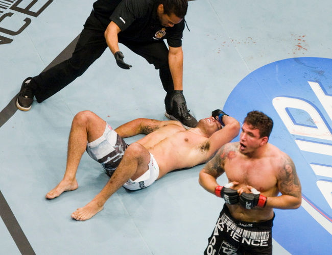 Frank Mir walks away after snappy Antonio "Minotauro" Nogueira's arm