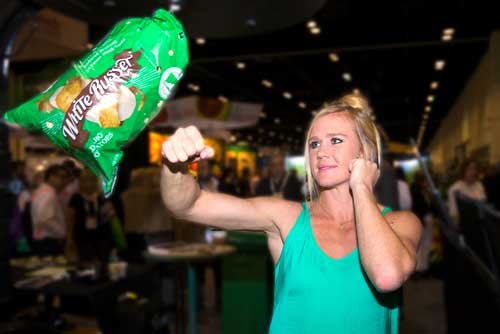 Can’t bruise this! MMA fighter Holly Holm attempts to bruise the White Russet™ reduced bruising potato at the 2016 PMA Fresh Summit in Orlando, FL at Potandon's Booth Photo credit: Alex Menendez, Associated Press Images.