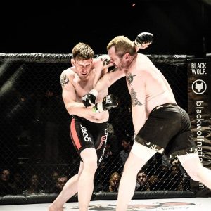 Jake Skelly (left) (article author) vs. Chris Tiernan at Victory Combat Sports 5 - Photo by Steve Bauzen