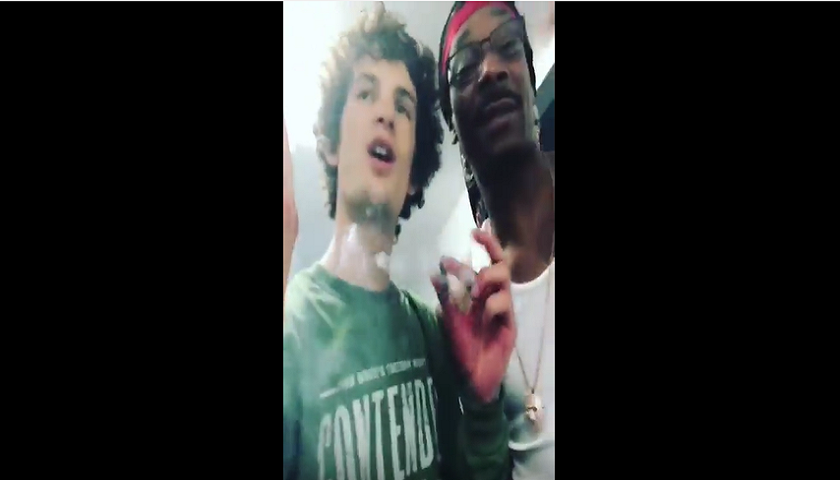 Snoop Dogg, Sean O'Malley smoking a blunt with Snoop Dogg