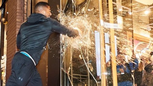 Boxing champ Anthony Joshua punches through glass at Under Armour store