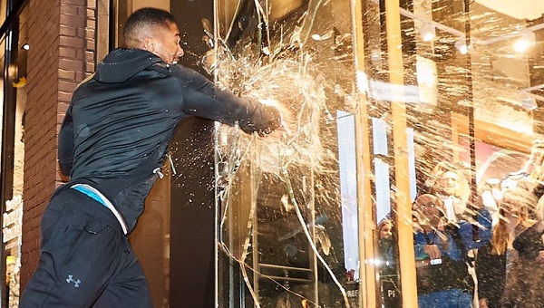 Boxing champ Anthony Joshua punches through glass at Under Armour store