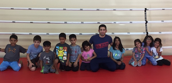 Abdul Kareem Al-Selwady trains children as he prepares for BRAVE 10