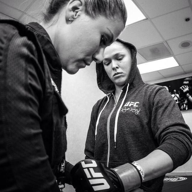 Swayze Valentine wrapping Ronda Rousey's hands