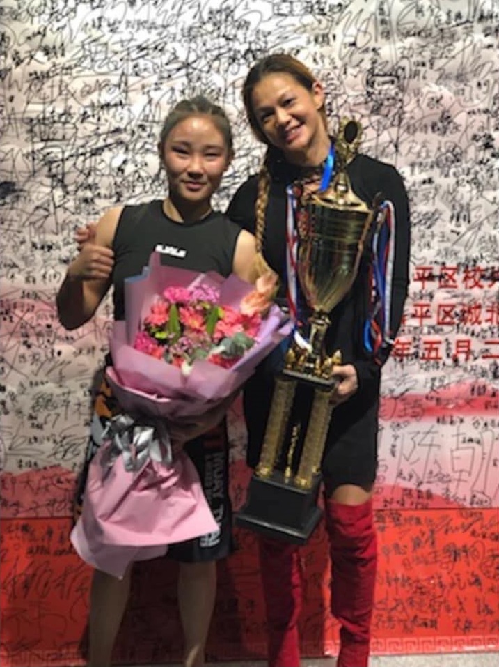 Wang Lu Ping and Andy Nguyen following their fight at Beijing Combat