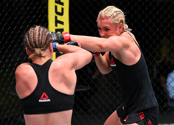 Yana Kunitskaya controls the fight against Julija Stoliarenko