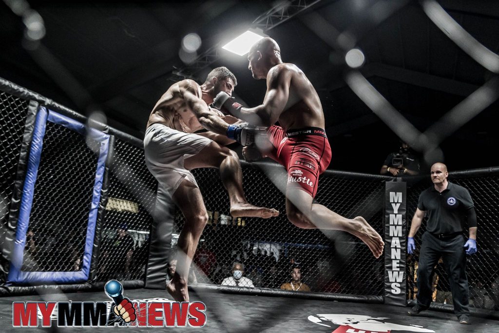 John Garbarino lands a kick on Robert Sousa right out the gate in the third round of their AOW 18 headlining title fight - Photo by William McKee for MyMMANews