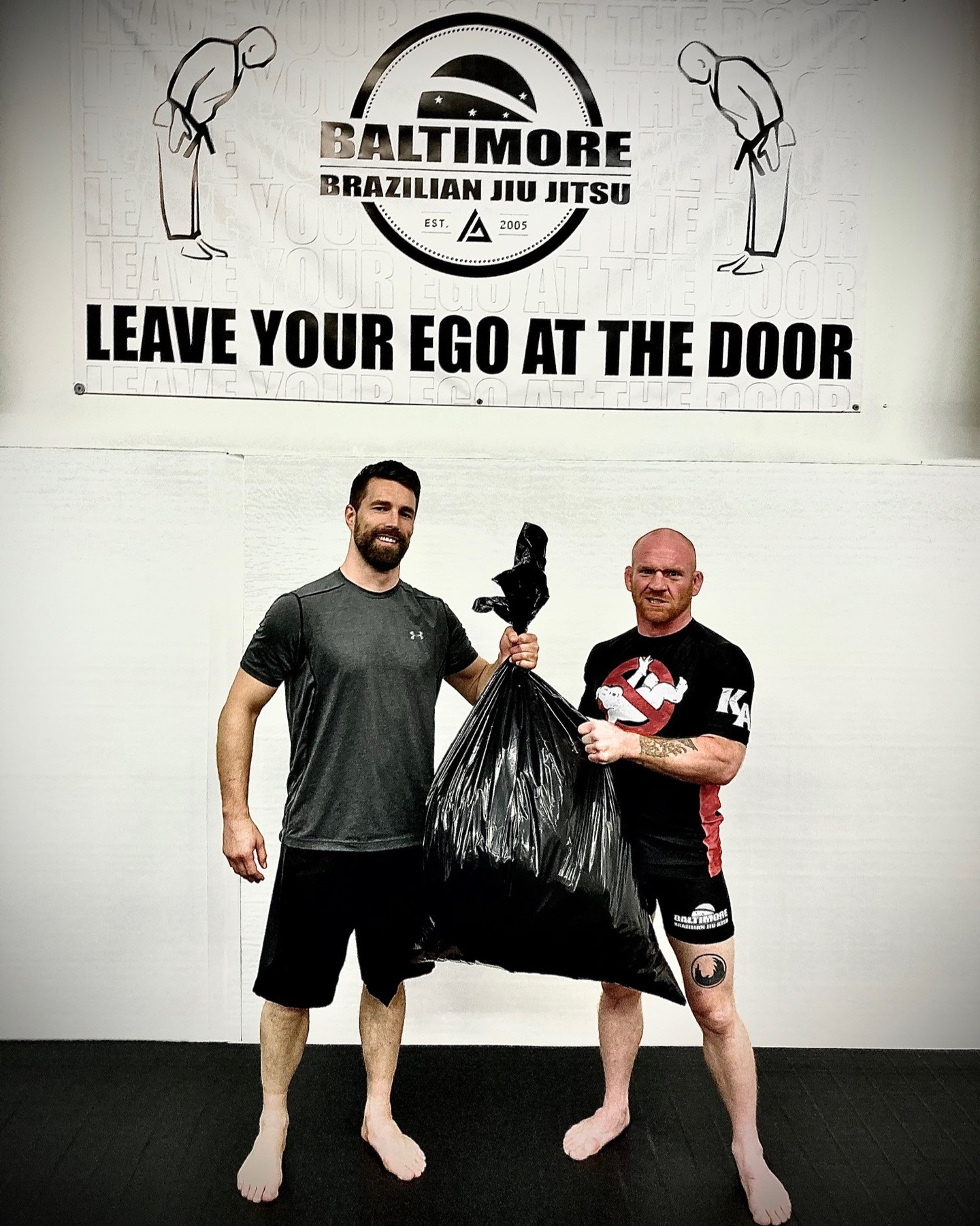 Colán Stiùbhard (left) and Robert Sullivan (right) with a garbage bag full of gi's ready to be delivered to Kao Jiu Jitsu in Ethiopia