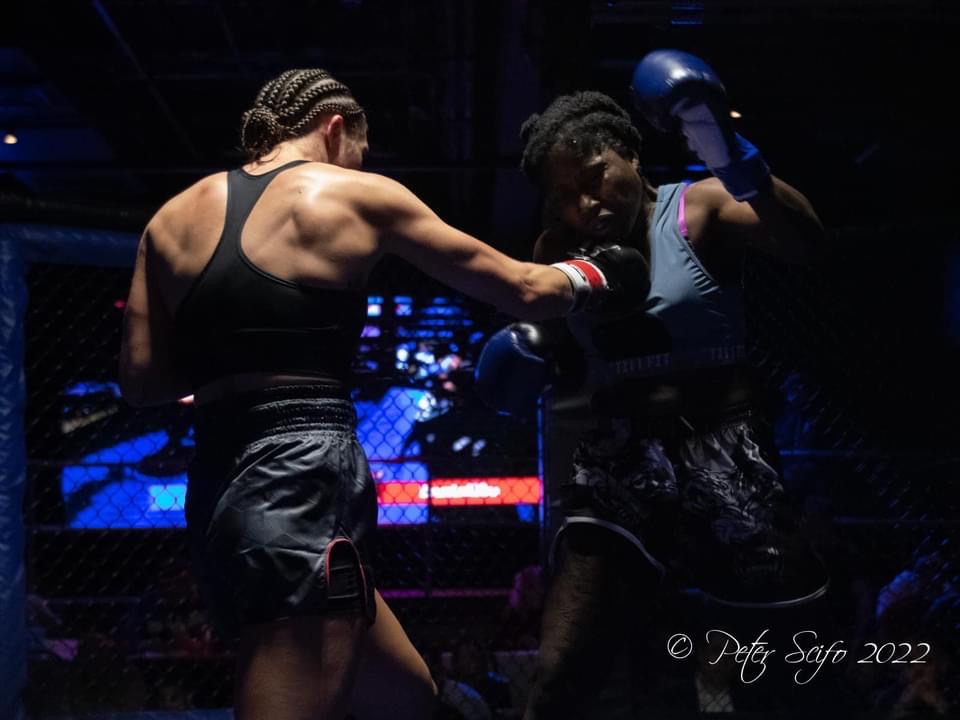 Mia Inzirilo connects with a right hand to the chin of Sharneka Wright. (Photo captured by Peter Scifo)
