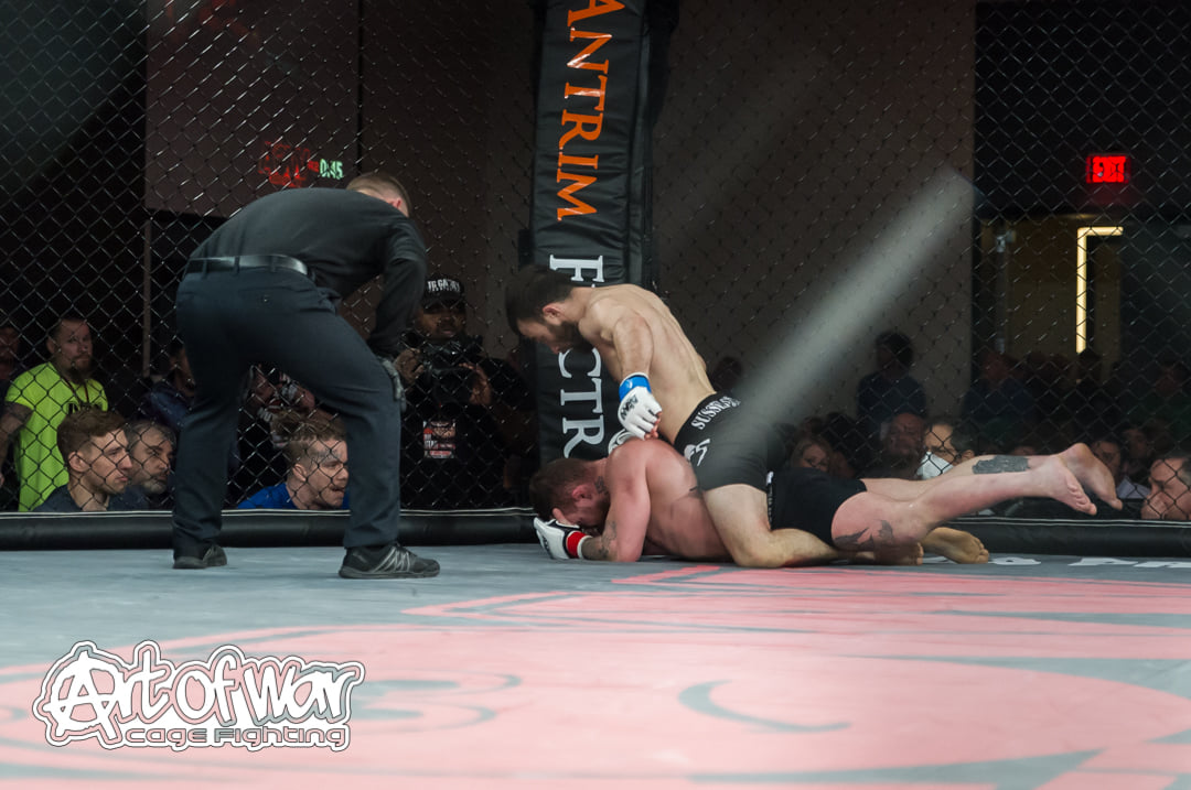 Jim Fitzpatrick finishes Will Dill in the second round at AOW 22 - Photo by William McKee