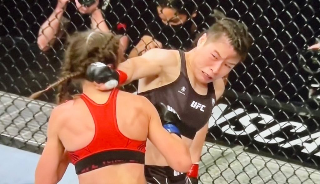 Weili Zhang KO's Joanna Jedrzejczyk with spinning back fist at UFC 275