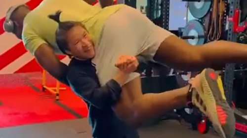 Zhang Weili lifts UFC heavyweight champion Francis Ngannou