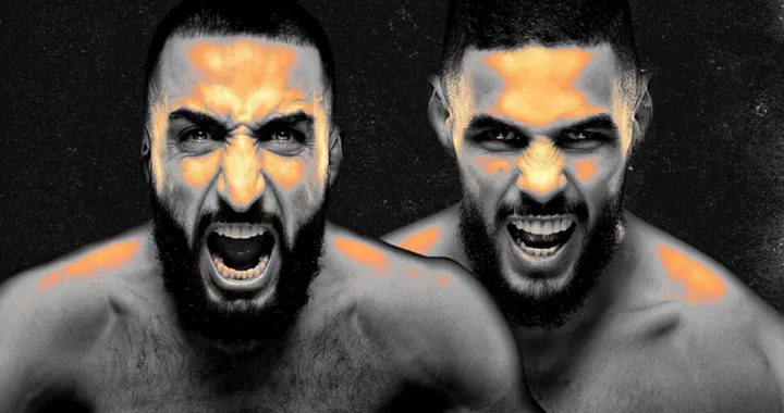 Two shirtless men with beards yell directly at the camera, orange highlights on their faces and shoulders against a dark background.